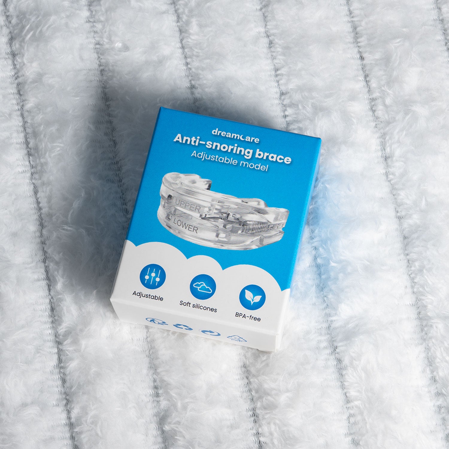 snurkbeugel in verpakking op bed